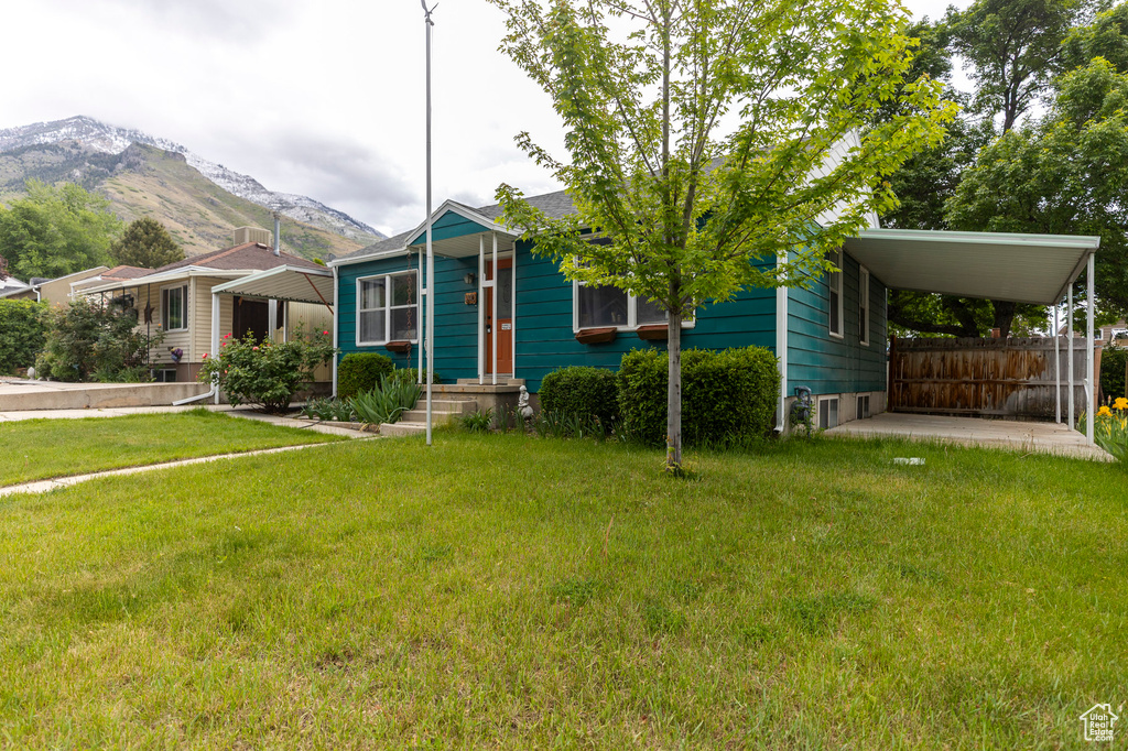 View of front of home featuring a mountain view