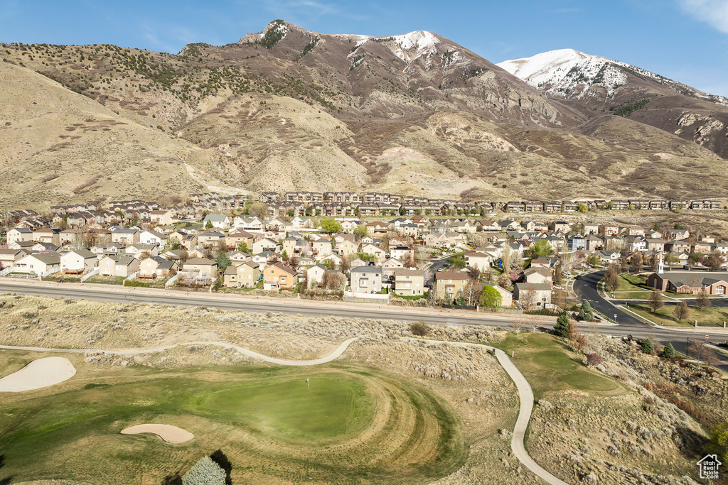 Property view of mountains with a residential view