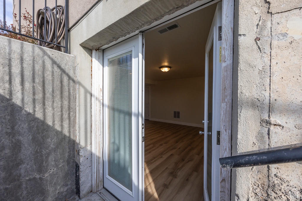 Entrance to property featuring visible vents