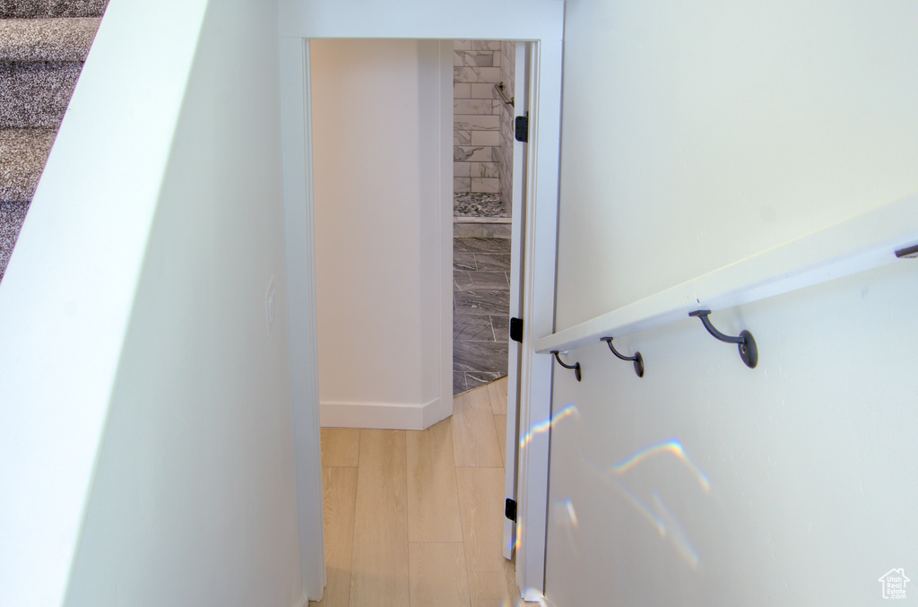 Bathroom featuring baseboards and wood finished floors
