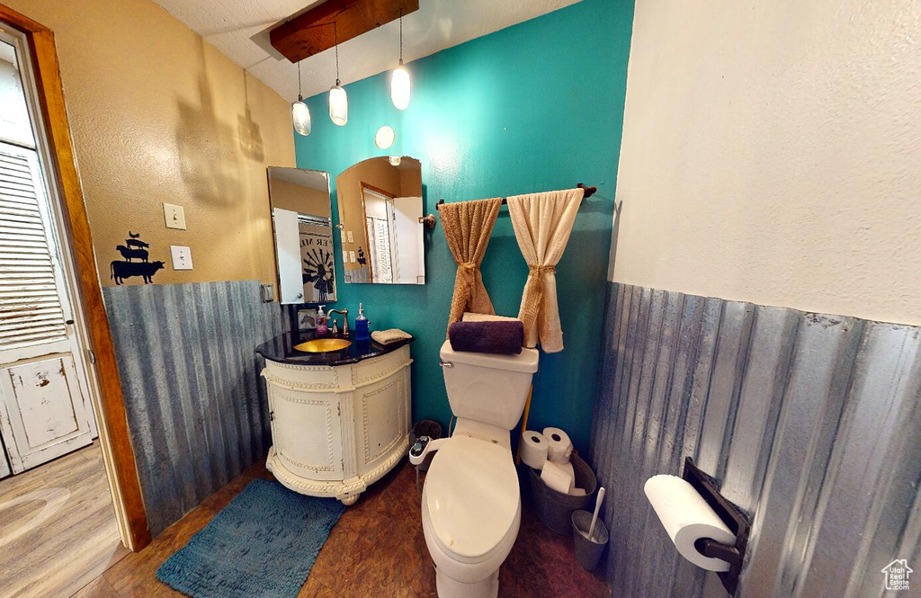 Bathroom featuring vanity and wood finished floors