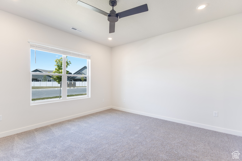 Unfurnished room featuring baseboards, carpet, a ceiling fan, and recessed lighting