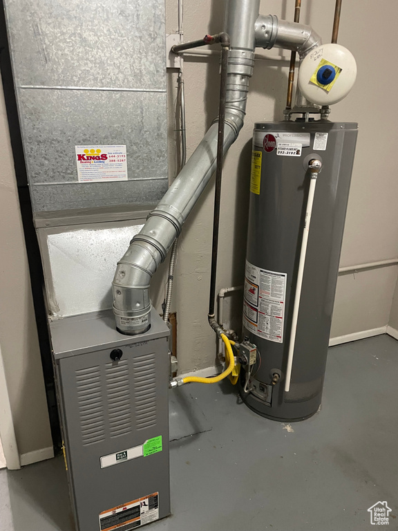 Utility room featuring gas water heater