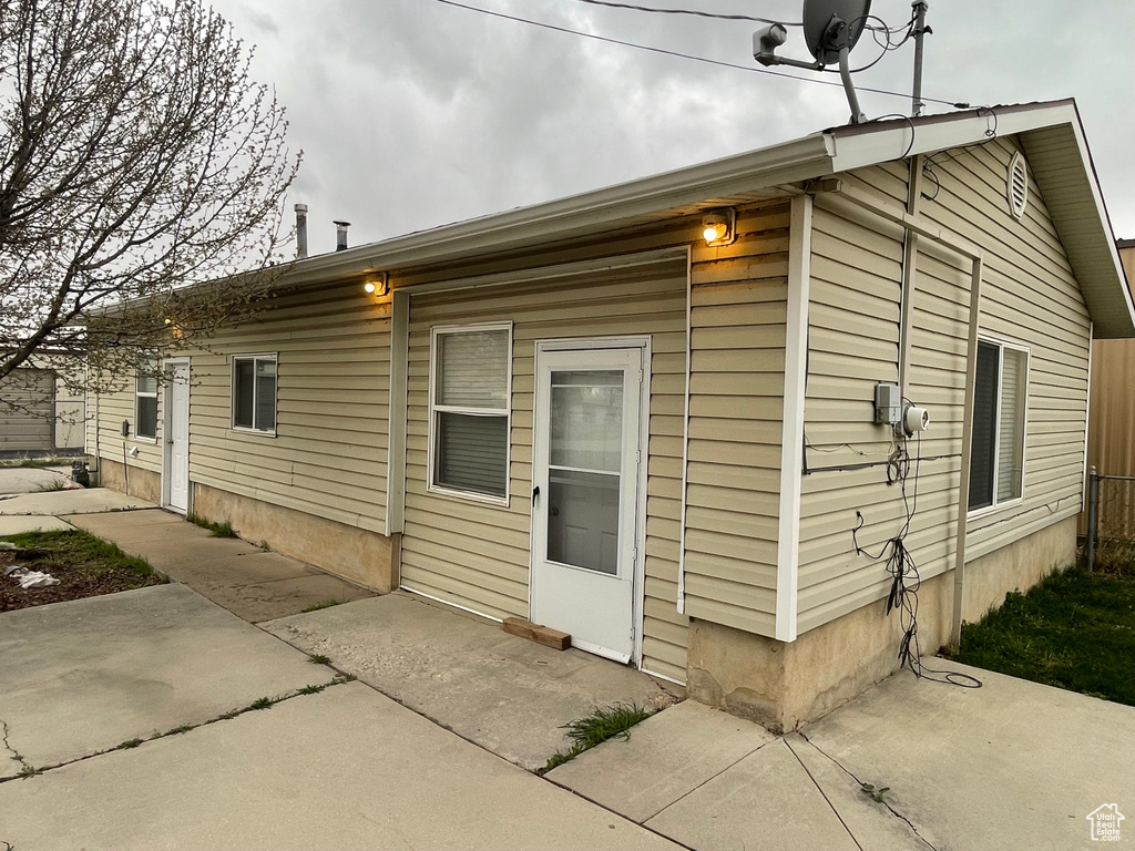 Rear view of property with a patio area