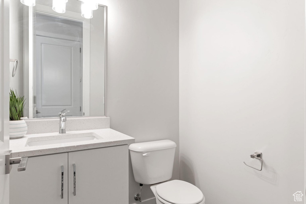 Half bath with toilet and vanity