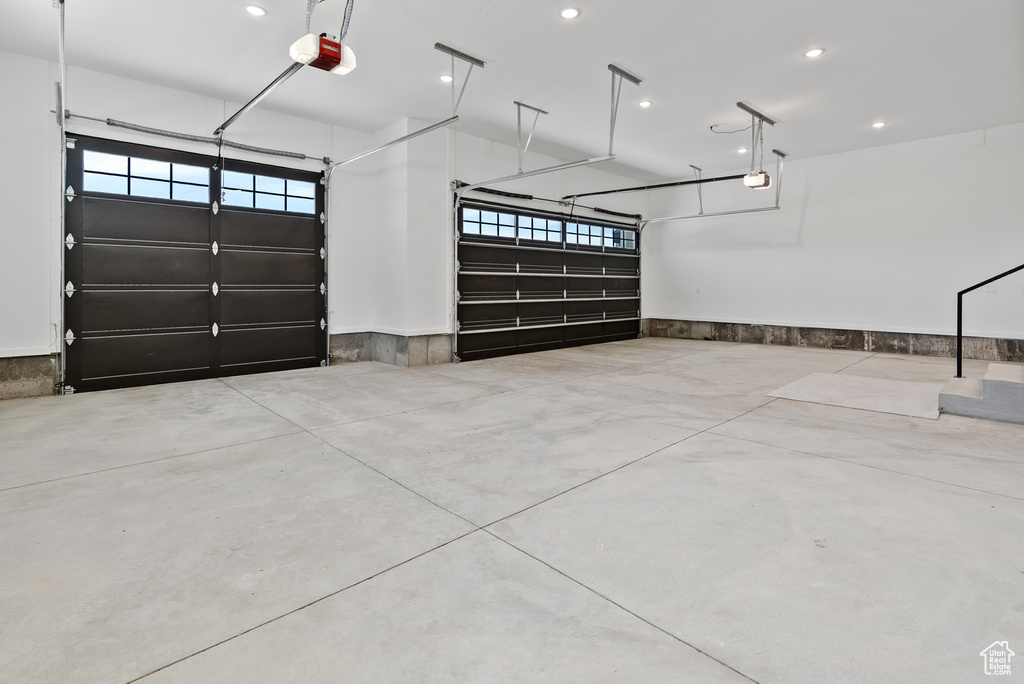 Garage featuring recessed lighting and a garage door opener