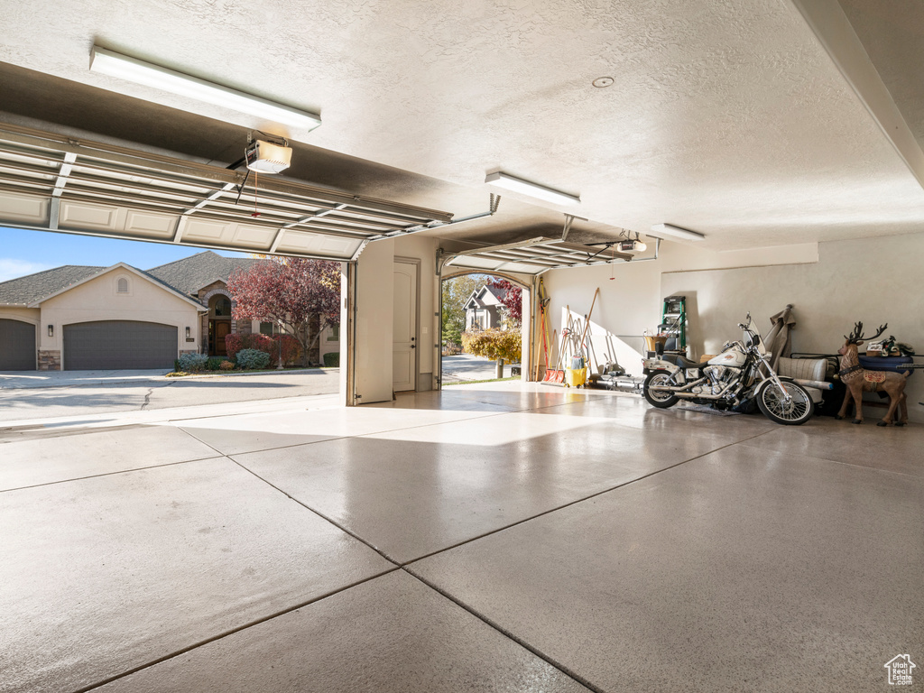 Garage featuring a garage door opener