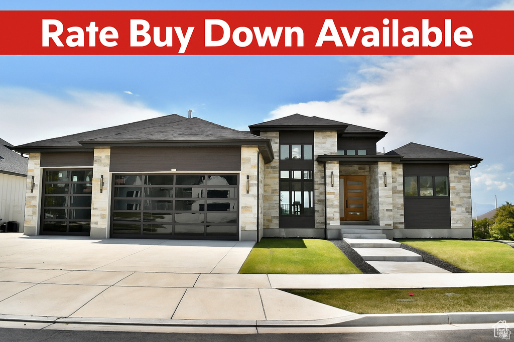 View of front of home featuring stone siding, an attached garage, driveway, and a shingled roof
