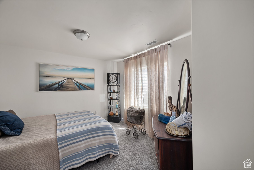 Bedroom with carpet and visible vents