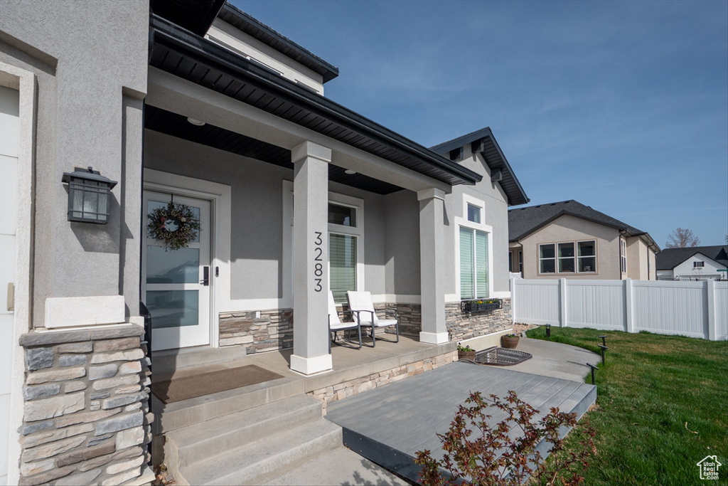 View of patio / terrace featuring covered porch and fence