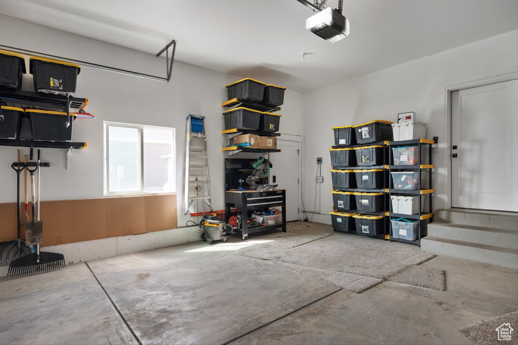 Garage featuring a garage door opener