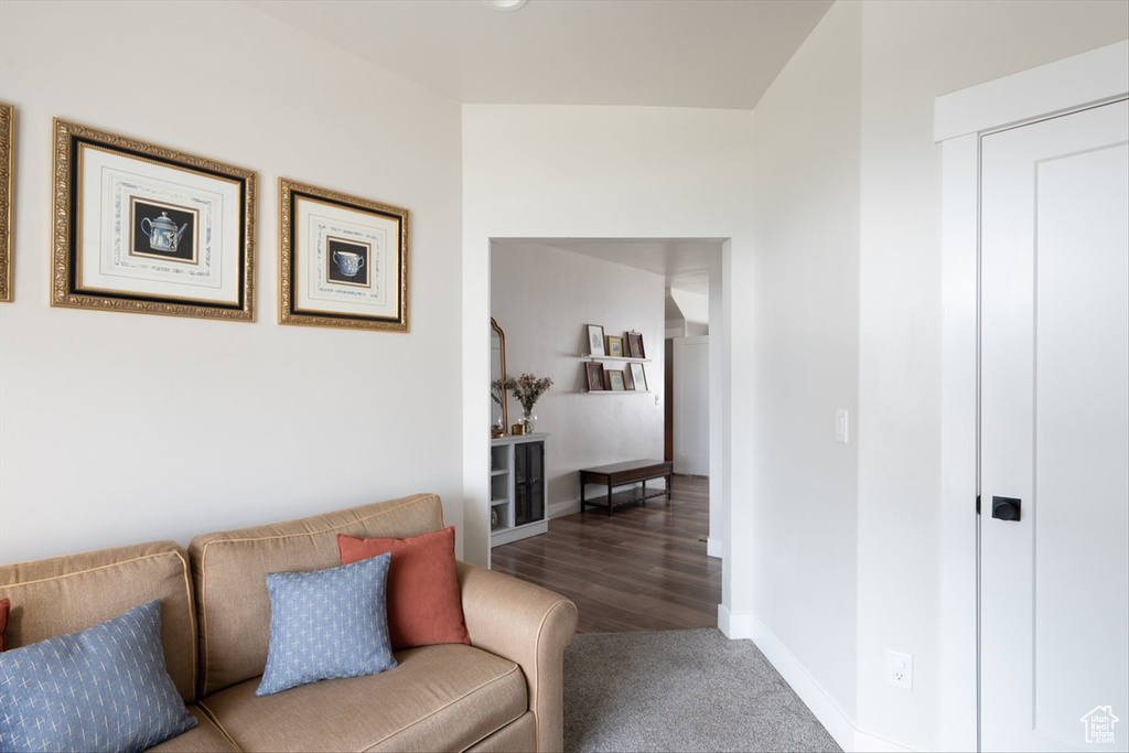 Hall with baseboards and carpet floors