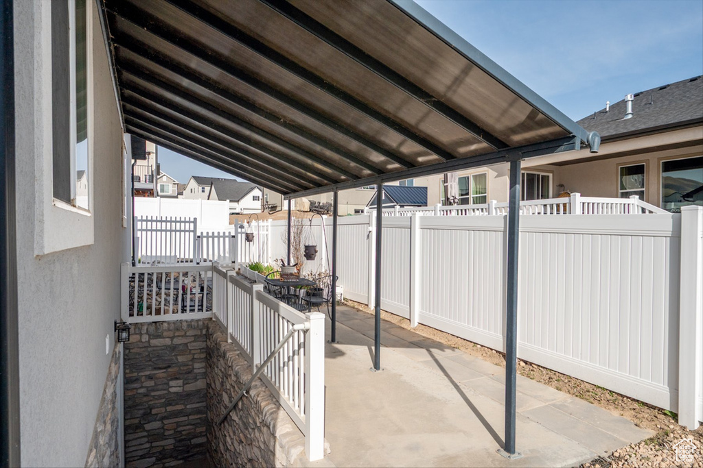 View of patio / terrace featuring a fenced backyard and a residential view