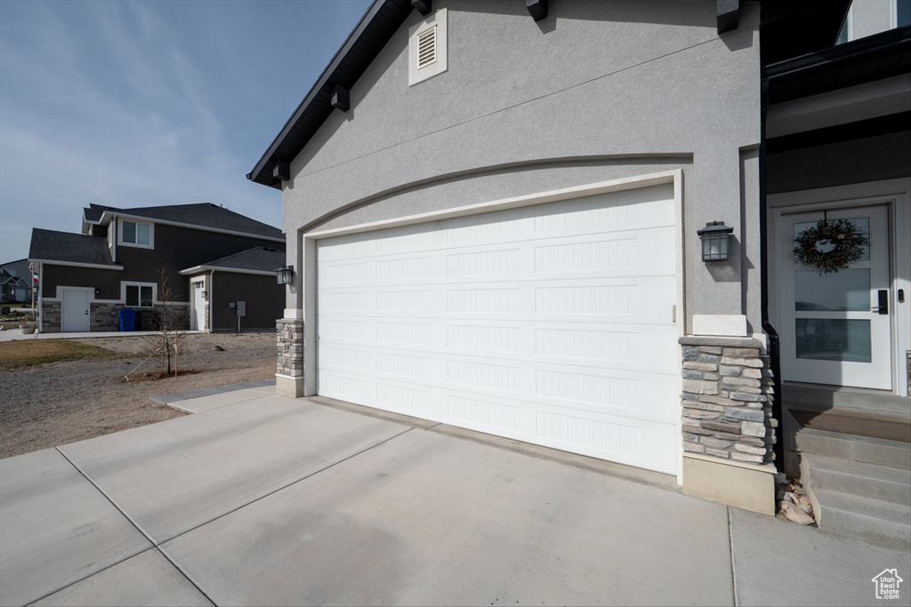 Garage featuring driveway