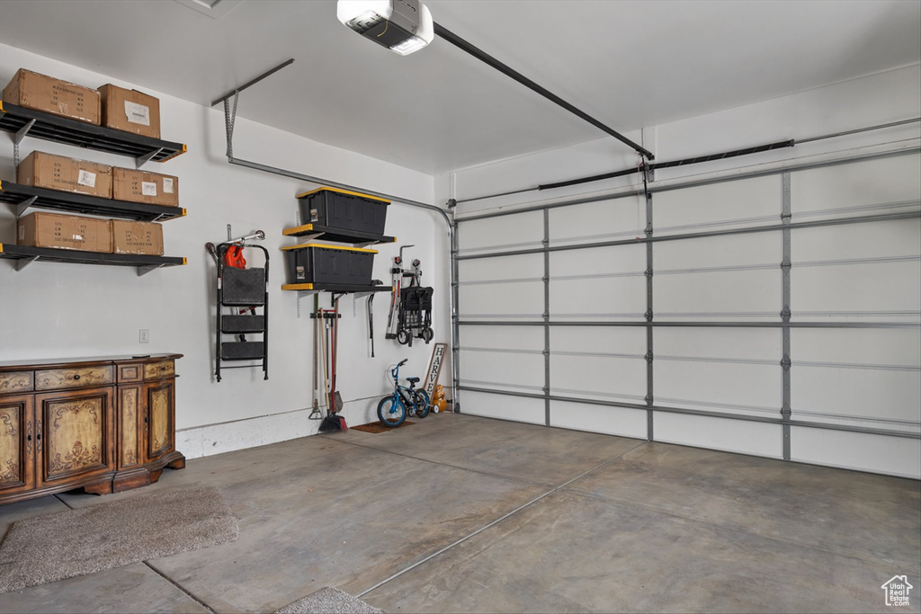 Garage featuring a garage door opener