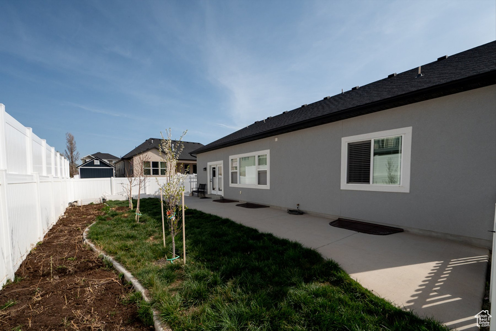 View of yard with a patio area and a fenced backyard