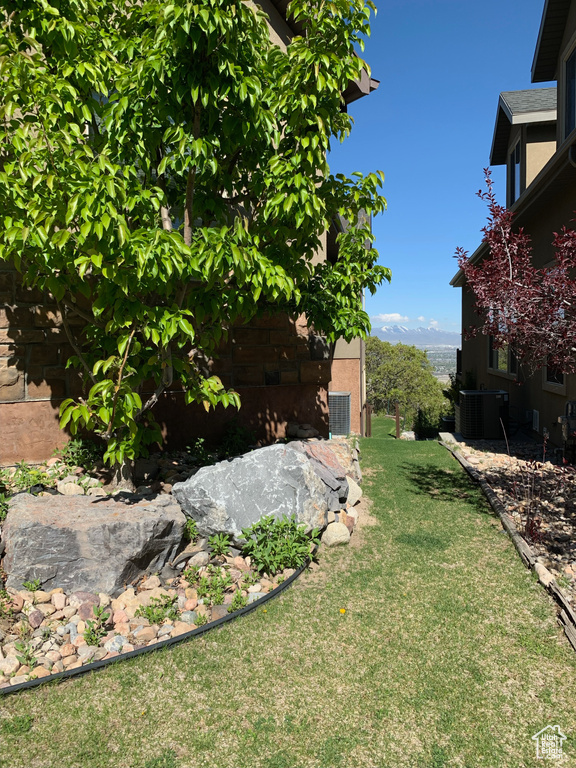 View of yard with central air condition unit