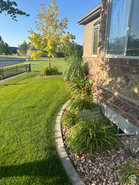 View of yard featuring fence