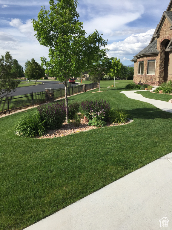 View of yard featuring fence