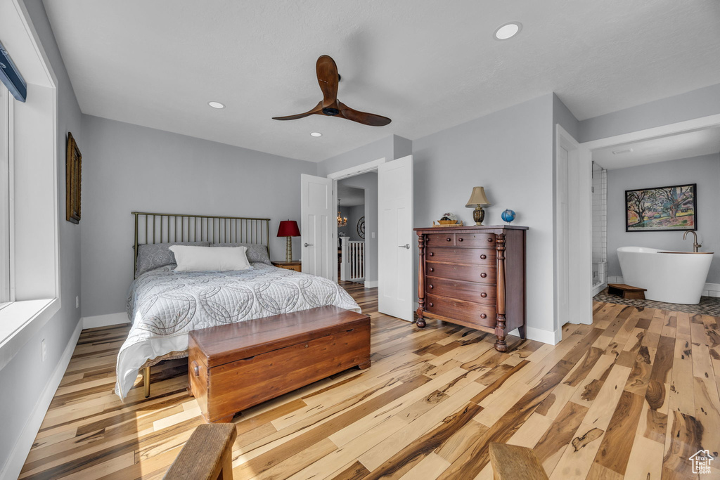 Bedroom featuring light wood-style floors, baseboards, and recessed lighting