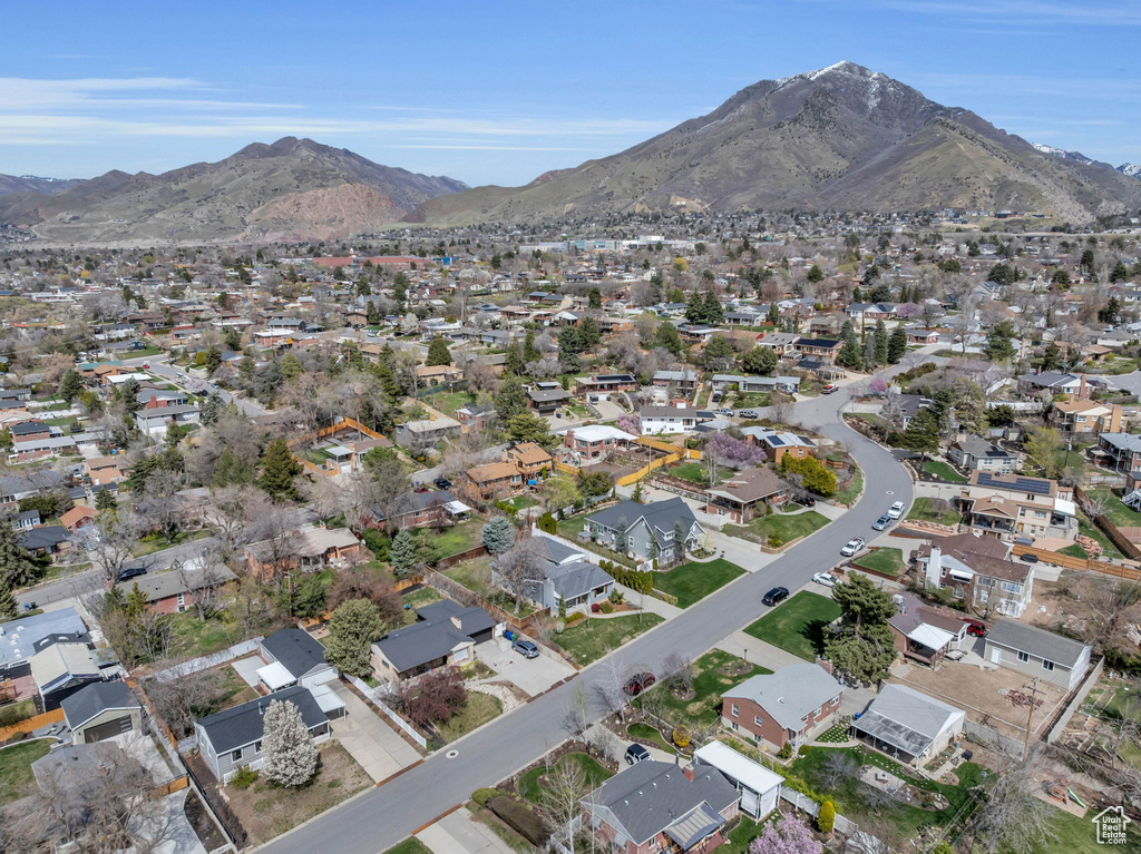 Birds eye view of property with a residential view and a mountain view