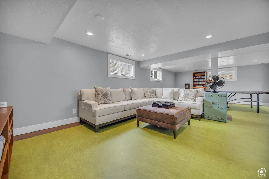 Living room featuring visible vents, baseboards, and recessed lighting