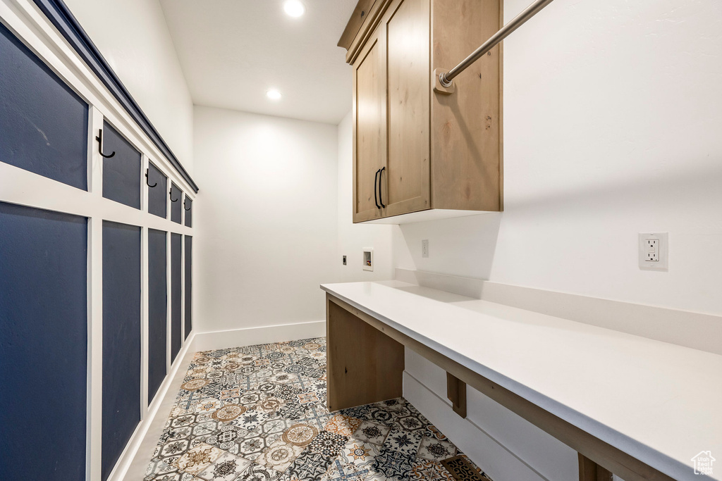 Laundry room with cabinet space, washer hookup, recessed lighting, an office area, and tile patterned flooring