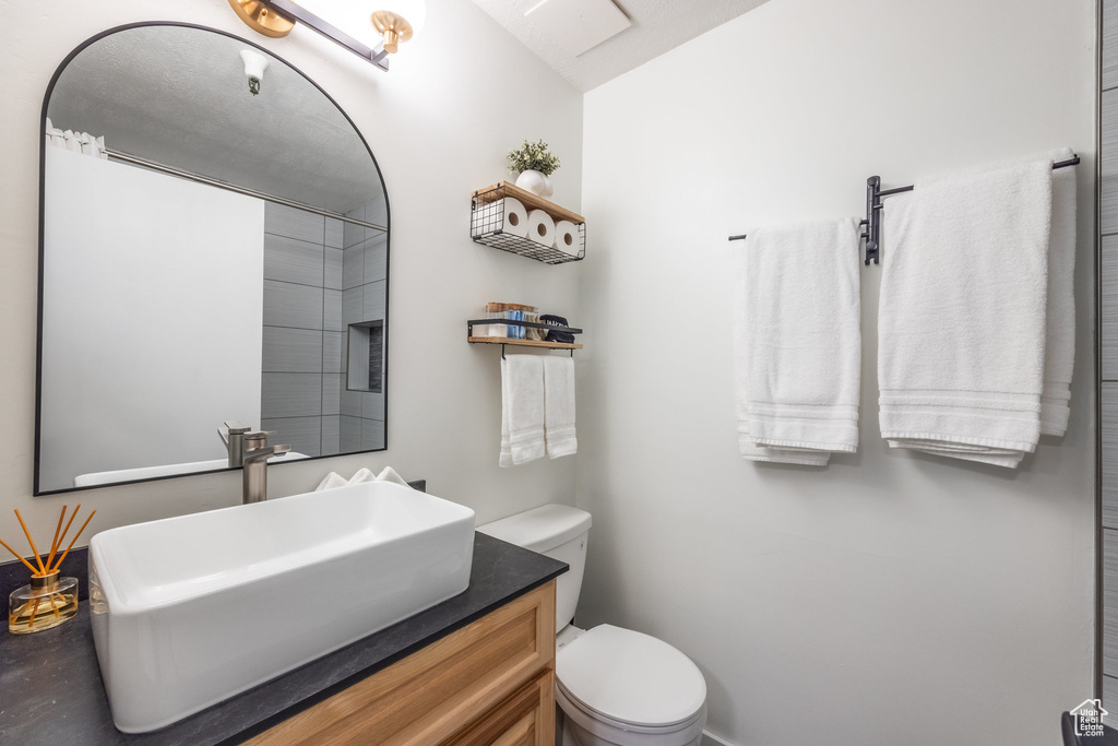 Bathroom featuring vanity and toilet