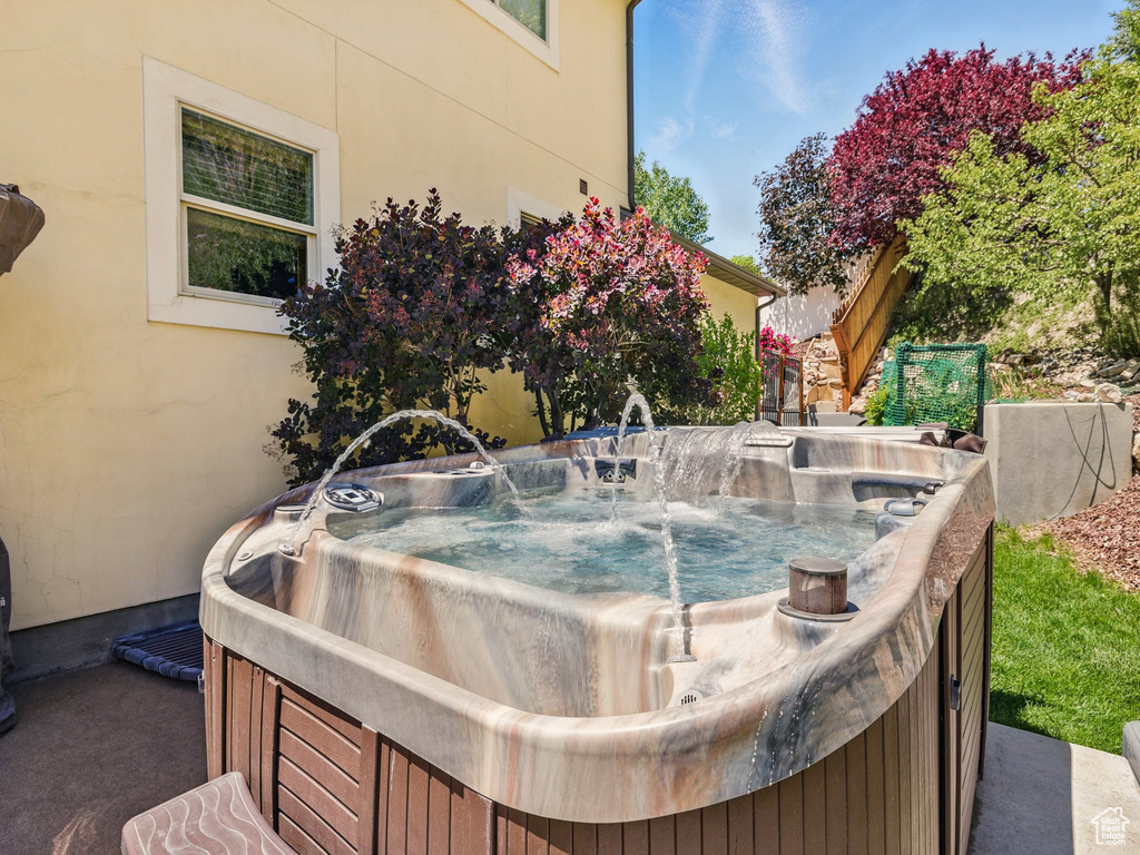 Exterior view of a jacuzzi and stucco siding