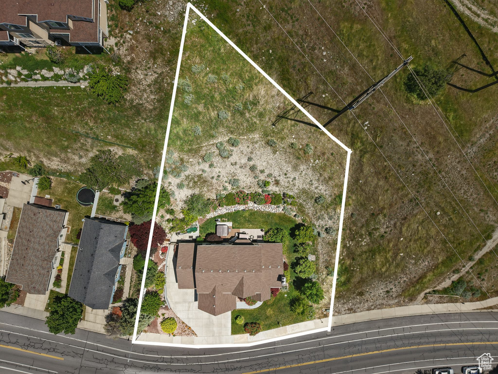 Aerial view of property and surrounding area with property parcel outlined