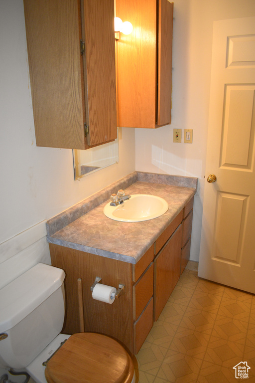 Bathroom featuring toilet and vanity