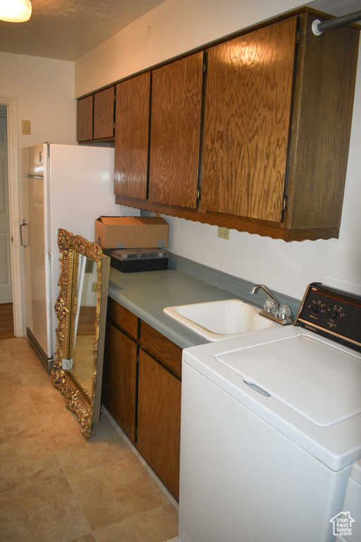 Washroom with washer / dryer and cabinet space