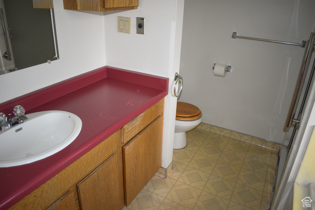 Bathroom featuring vanity and tile patterned flooring