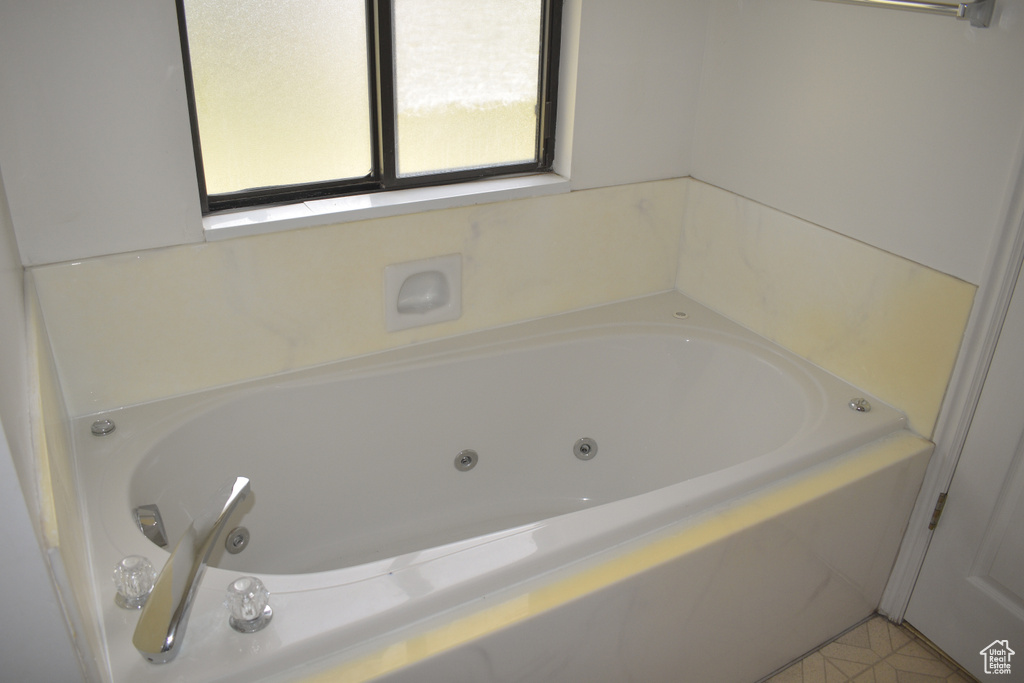Full bath featuring a jetted tub
