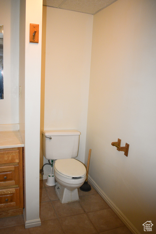 Bathroom with tile patterned floors and vanity