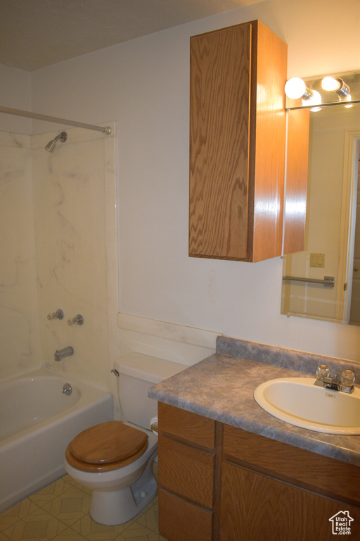 Bathroom featuring vanity and  shower combination