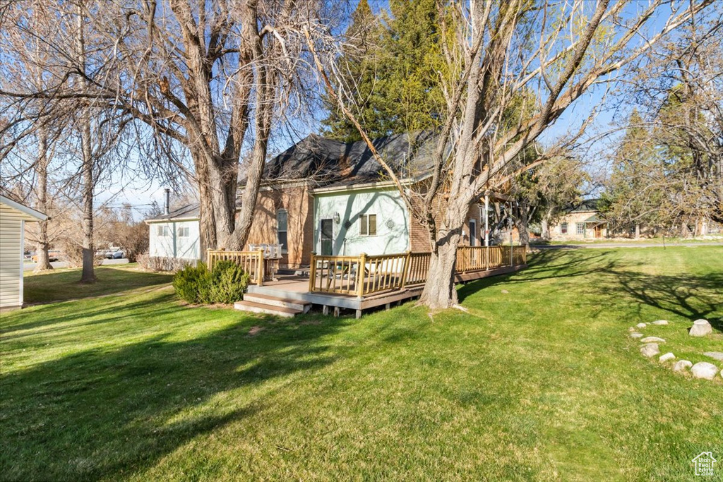 View of yard with a deck