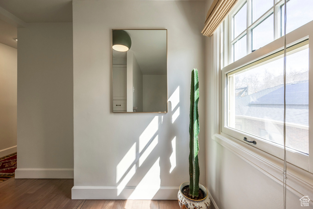 Interior details with baseboards and wood finished floors