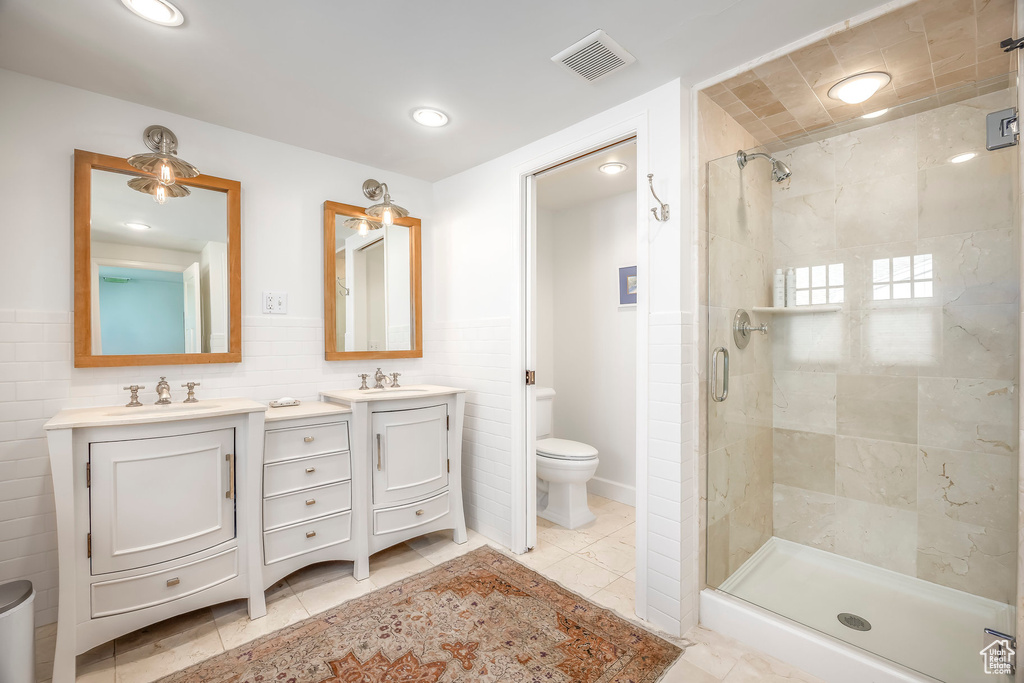 Bathroom with vanity, visible vents, toilet, recessed lighting, and a stall shower