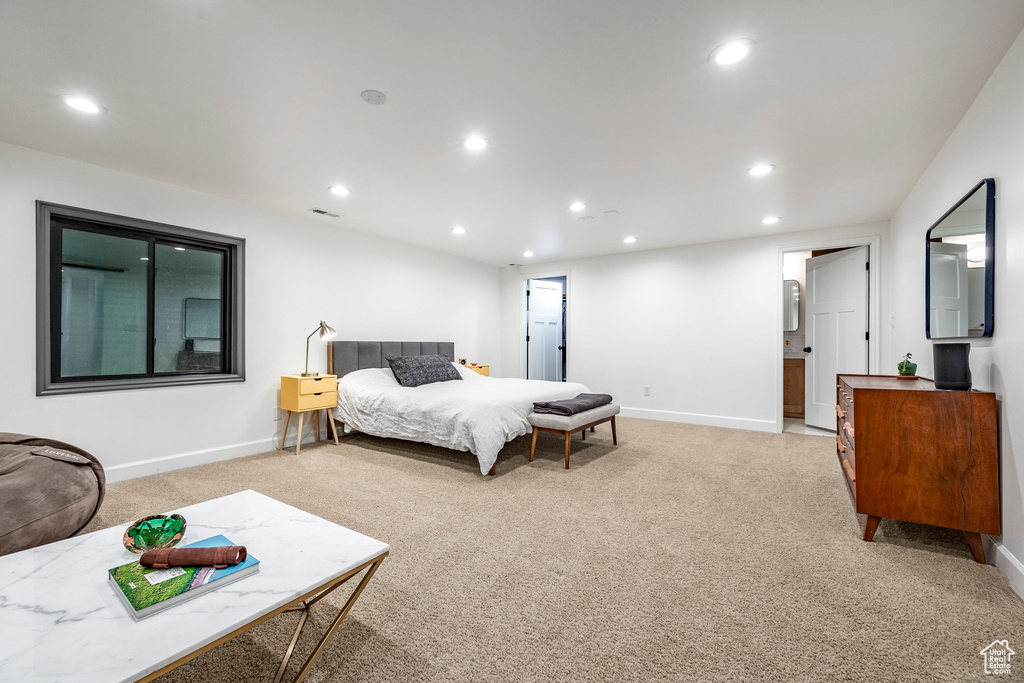Bedroom featuring light carpet, recessed lighting, and baseboards