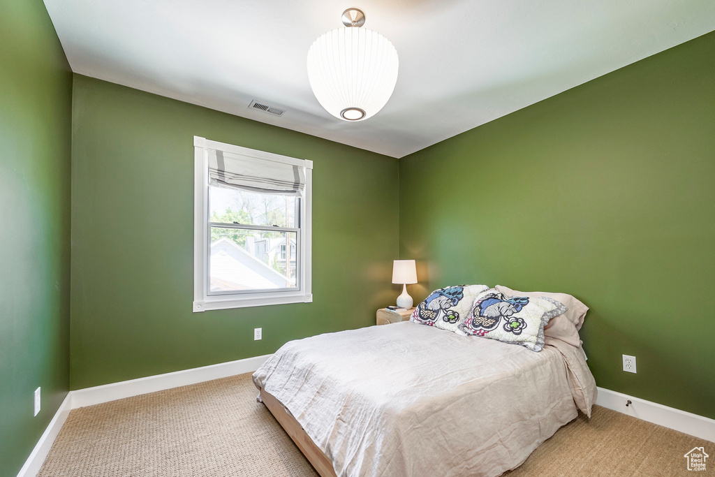 Bedroom with carpet and baseboards