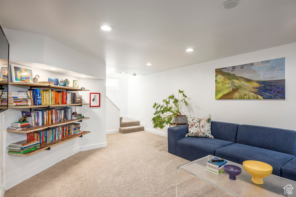 Carpeted living room with recessed lighting, stairs, and baseboards
