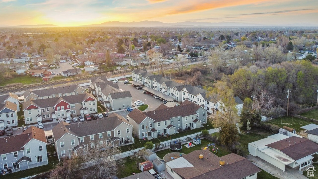 Aerial view at dusk with a residential view and a mountain view