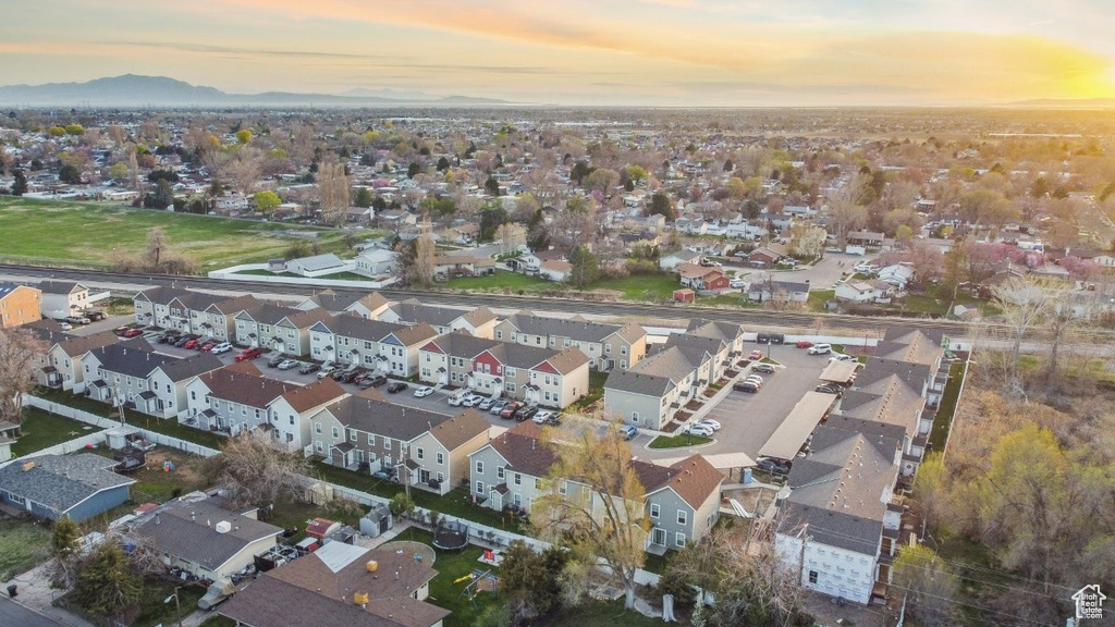 Aerial view at dusk featuring a mountain view and a residential view