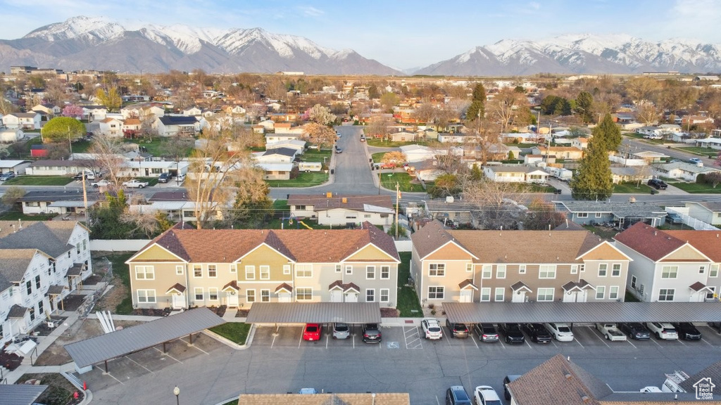 Birds eye view of property with a residential view and a mountain view