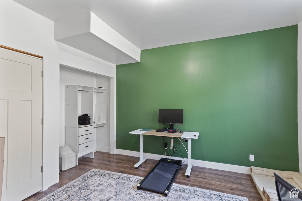 Office area featuring wood finished floors and baseboards