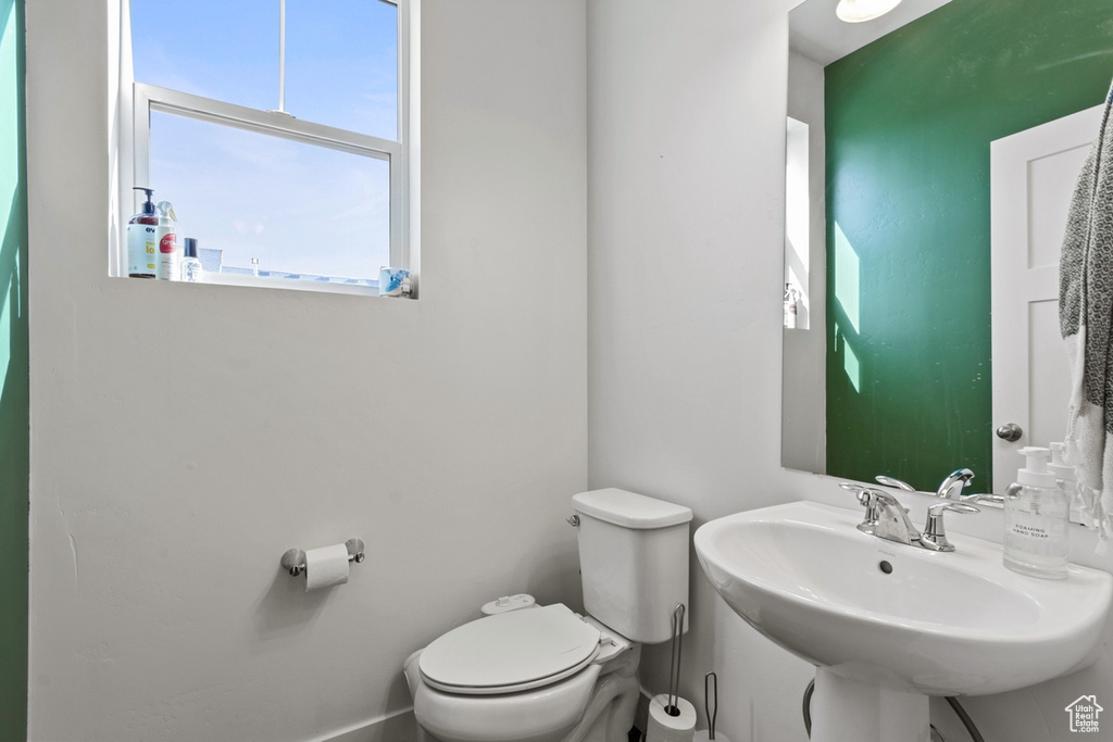 Bathroom featuring toilet and a sink