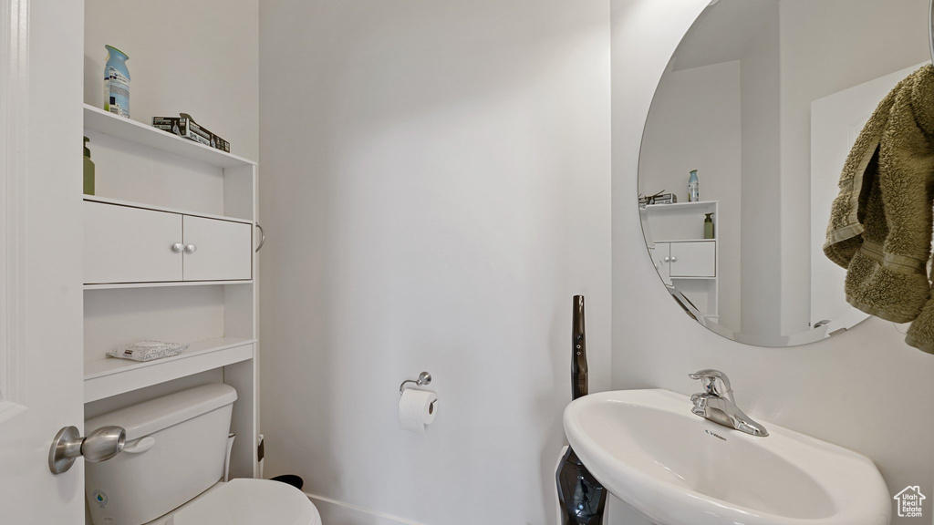 Bathroom featuring a sink and toilet