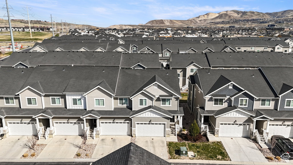 Birds eye view of property featuring a mountain view and a residential view