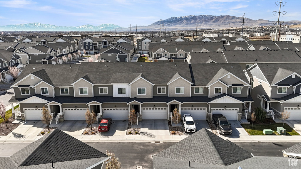 Birds eye view of property featuring a mountain view and a residential view